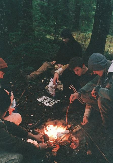 Friends gathered around a campfire