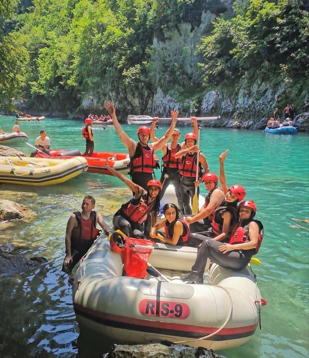 Group rafting together on a river